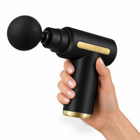 Pistolet de massage Mini tenu dans la main